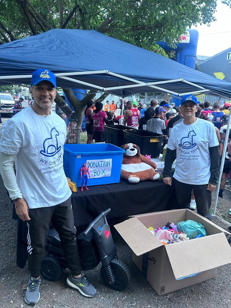 We Give Toys team at the donation table